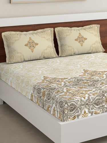 https://cdn.shopify.com/s/files/1/1857/6931/products/0cbb6a34-cda8-44a7-9d1d-691a770c32321644433043653DDecorBeigeGreyEthnicMotifs180TCCotton1KingBedsheetwith2Pill2.jpg?v=1703244577